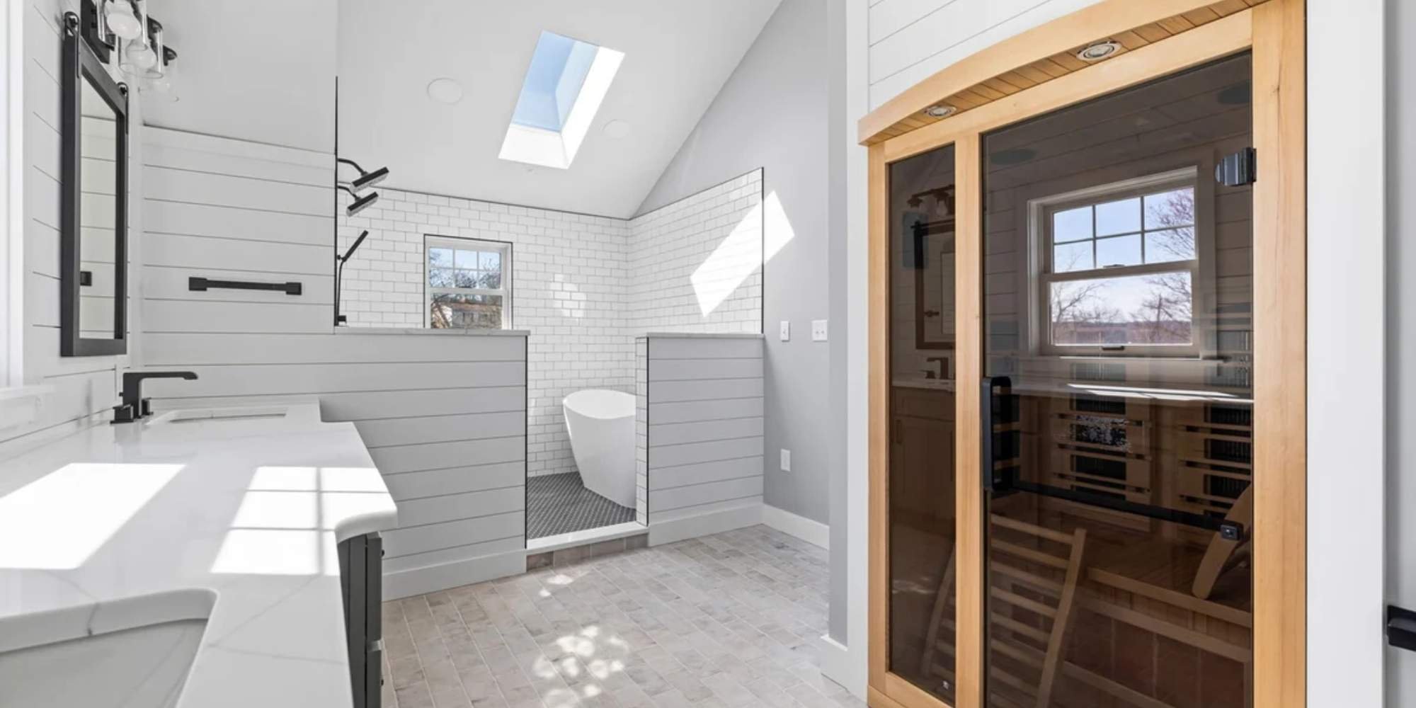 Bathroom with skylight and built-in sauna by Doxa Custom Homes in Middle Tennessee