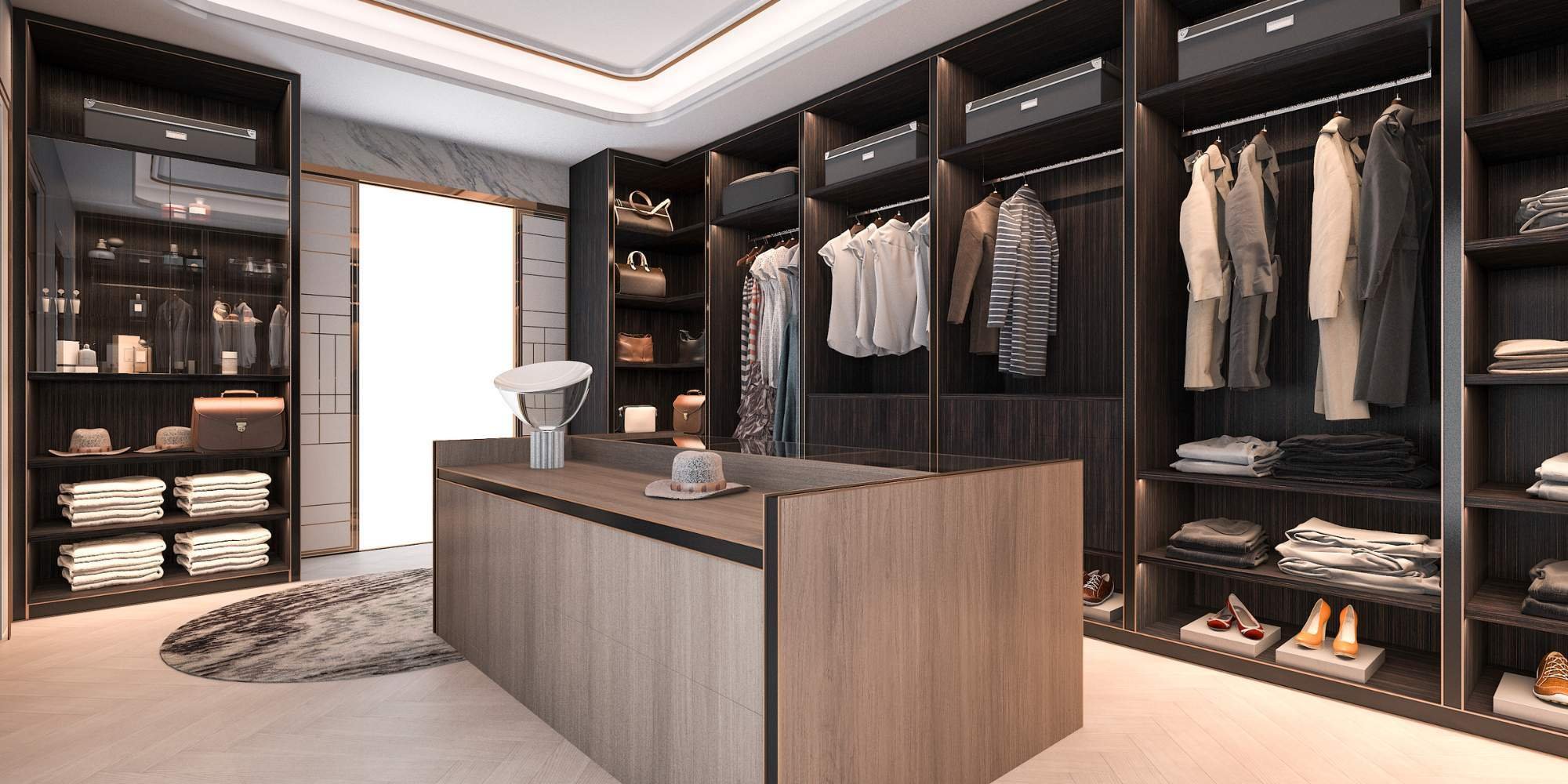 Custom dressing room with dark wood cabinetry by Doxa Custom Homes in Middle Tennessee