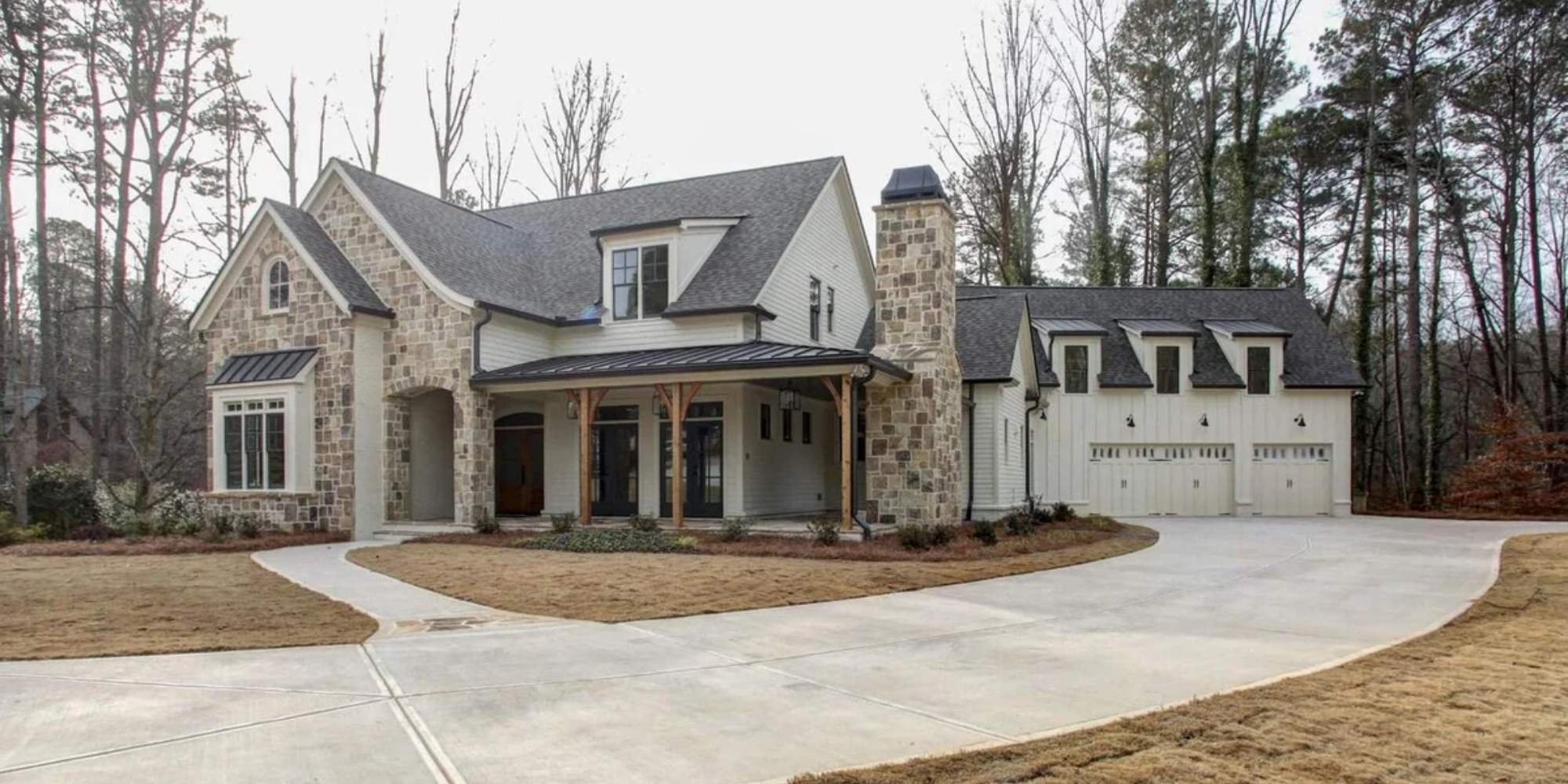 New construction by Doxa Custom Homes featuring stone and wood architectural blend in TN