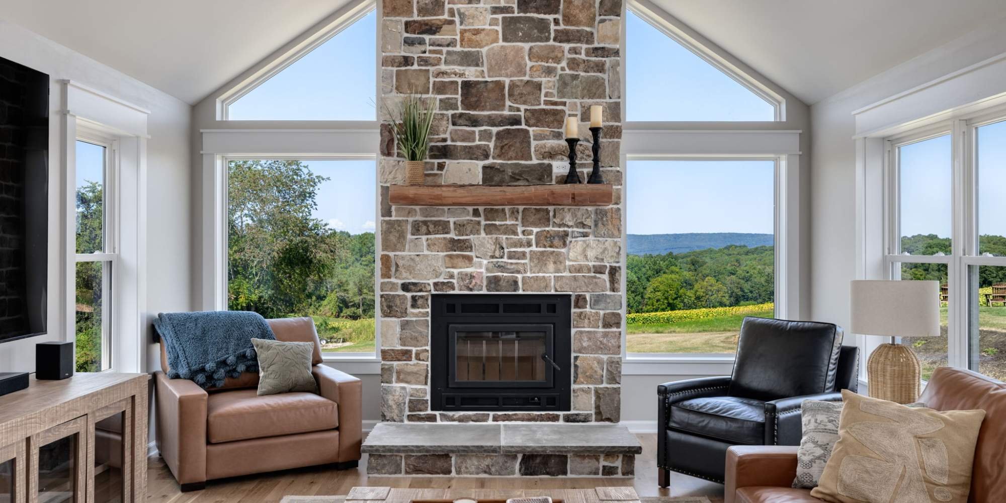 Bright living space with large windows and country views in a Doxa custom home