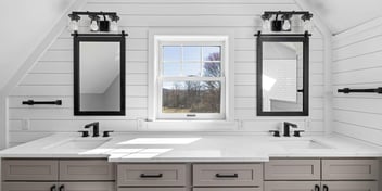 Double vanity with black fixtures and white shiplap walls by Doxa Custom Homes