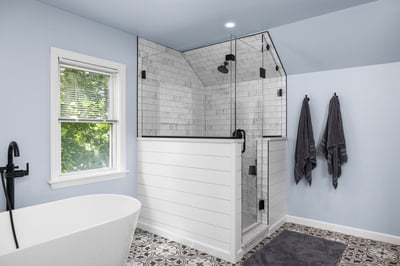 Bright bathroom remodel featuring tub and tiled shower by Doxa Custom Homes in Crossville, Tennessee