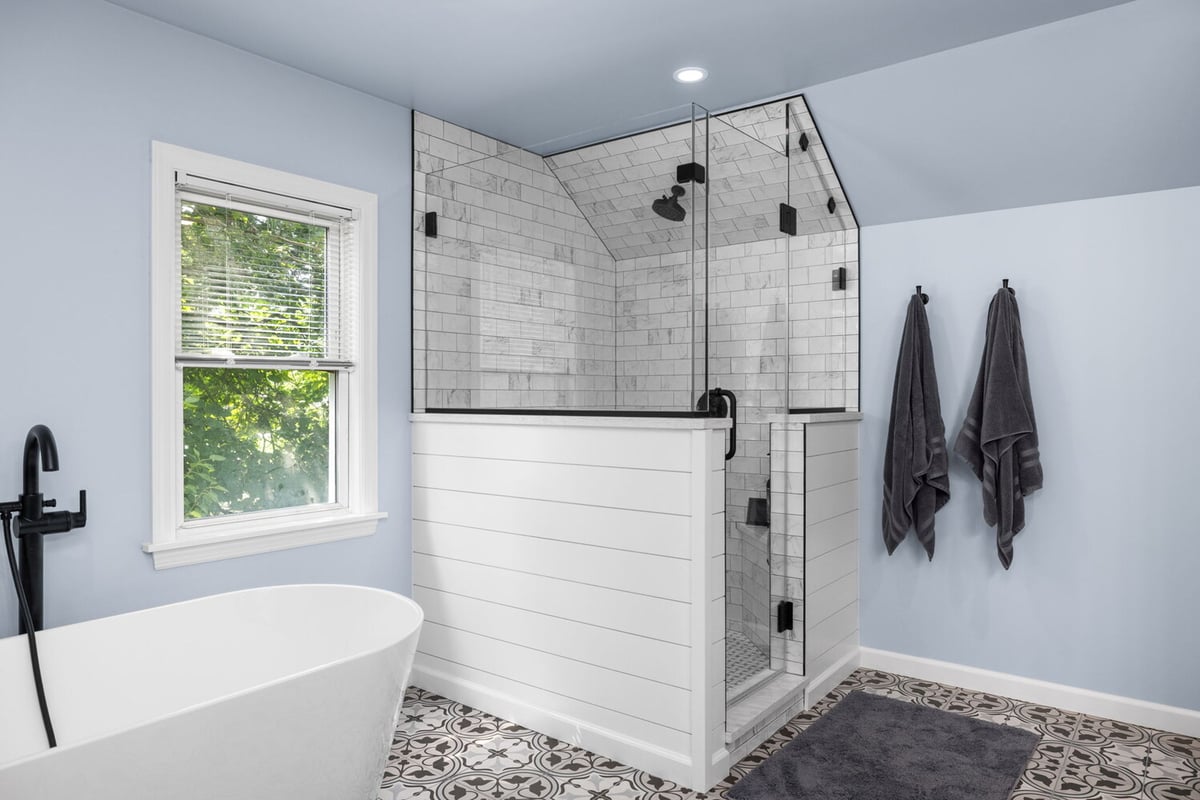 Bright bathroom remodel featuring tub and tiled shower by Doxa Custom Homes in Crossville, Tennessee