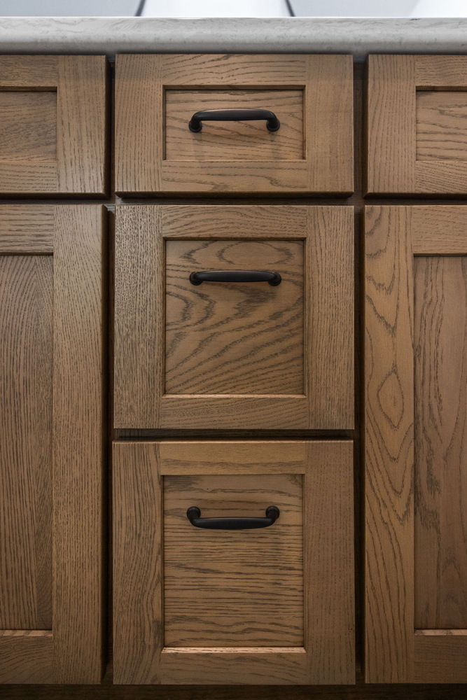 Close-up of oak kitchen drawers installed by Doxa Custom Homes in Murfreesboro, Tennessee