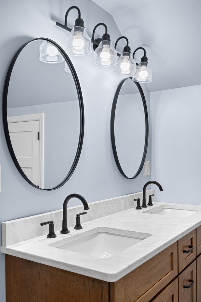 Double vanity with black fixtures and mirrors in a Doxa Custom Homes bathroom in Cookeville, TN
