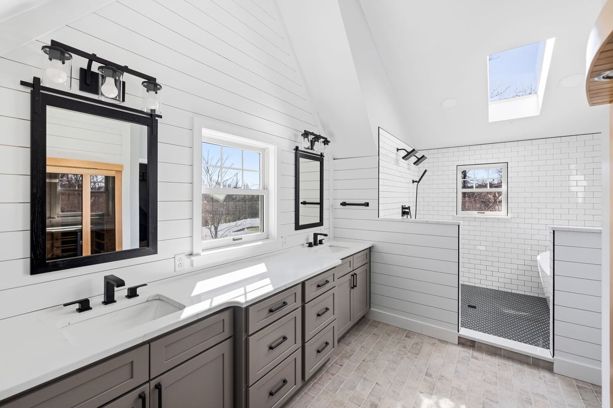 Double vanity with quartz counters and custom cabinetry by Doxa Custom Homes in Crossville, TN