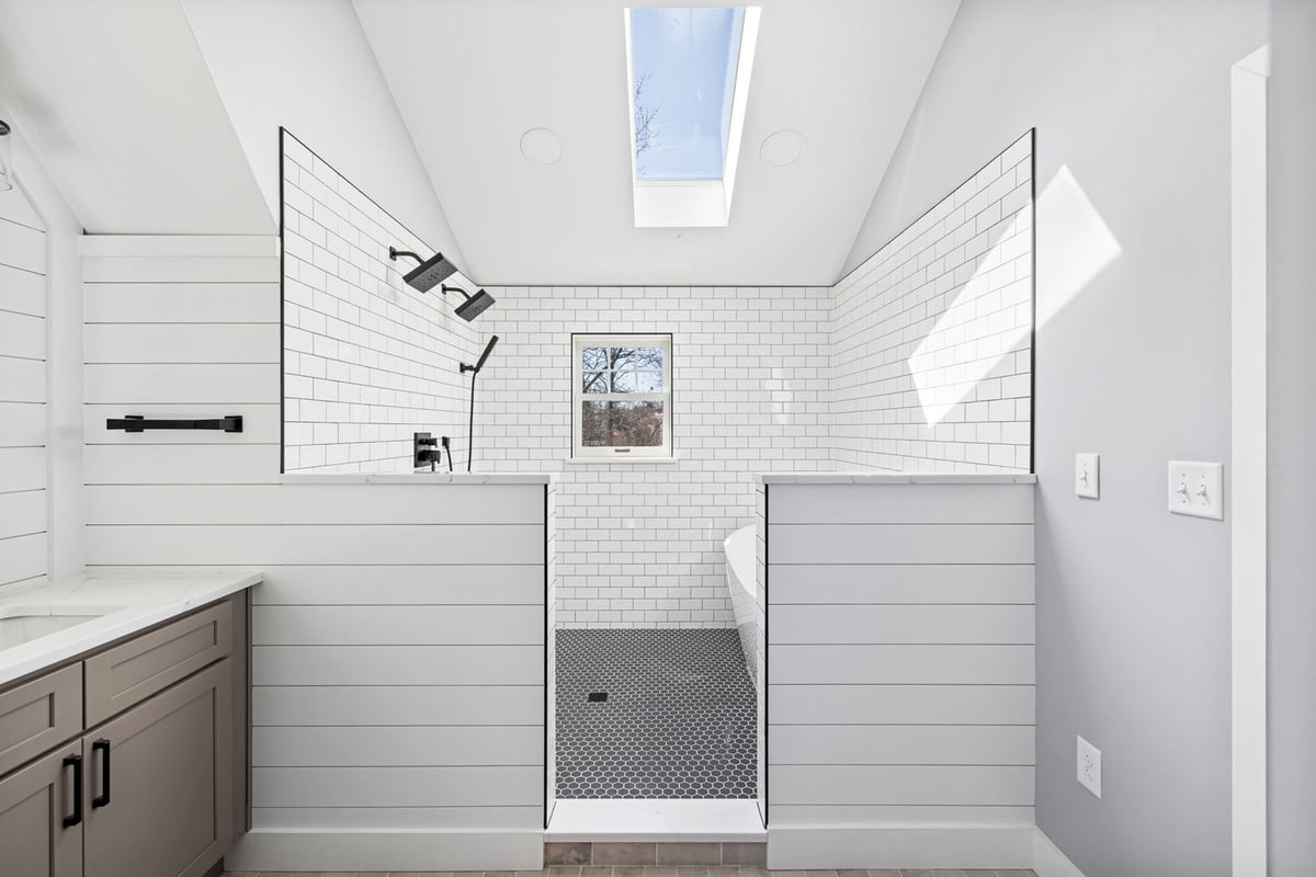 Spacious bathroom with skylight and walk-in shower by Doxa Custom Homes in Crossville, TN