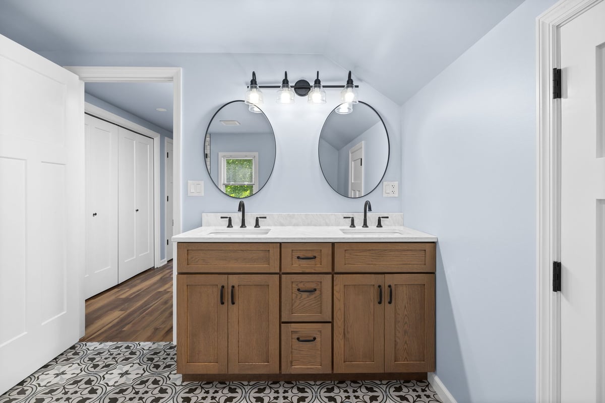Shiplap bathroom with dual vanity and black fixtures by Doxa Custom Homes in Cookeville, TN