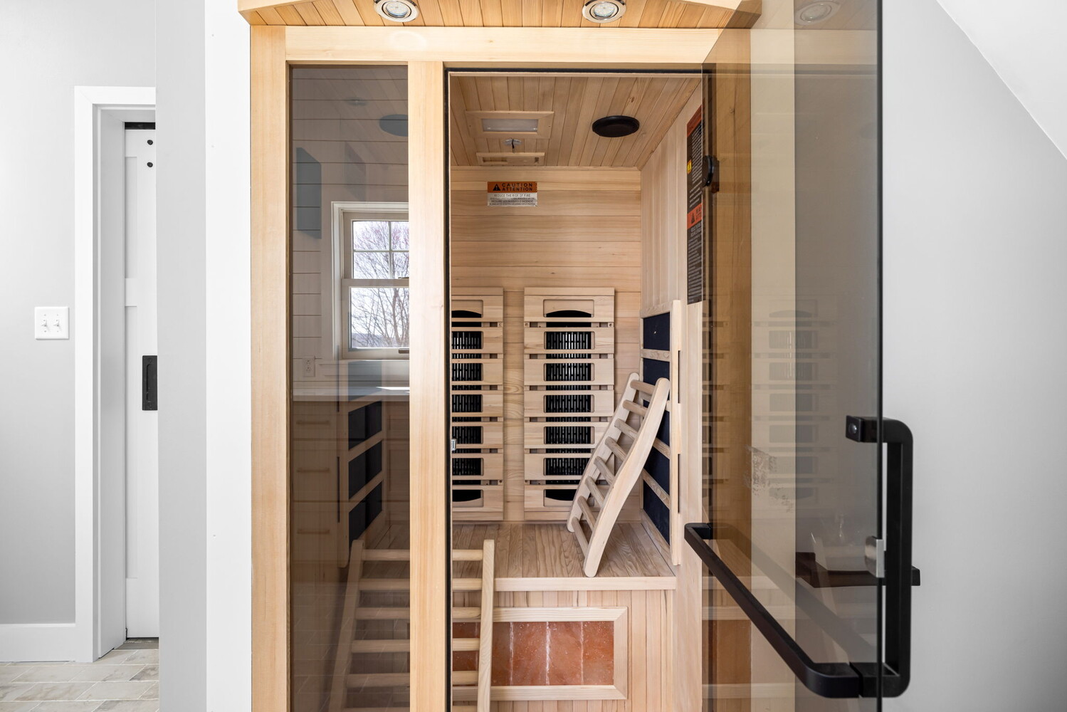 Luxury wood sauna inside custom bathroom by Doxa Custom Homes in Crossville, TN