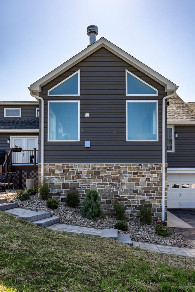 Triangular window facade of custom home addition by Doxa Custom Homes in Lebanon, TN
