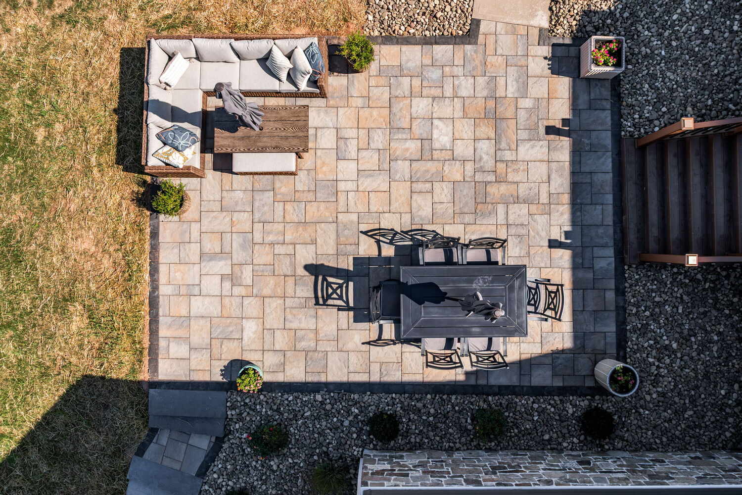 Aerial view of custom patio with paver design and outdoor seating by Doxa Custom Homes in Murfreesboro, TN